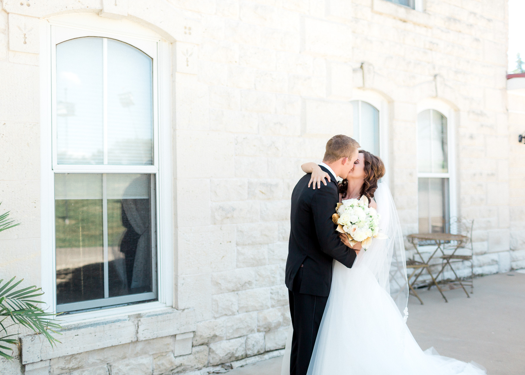 bride and groom kissing