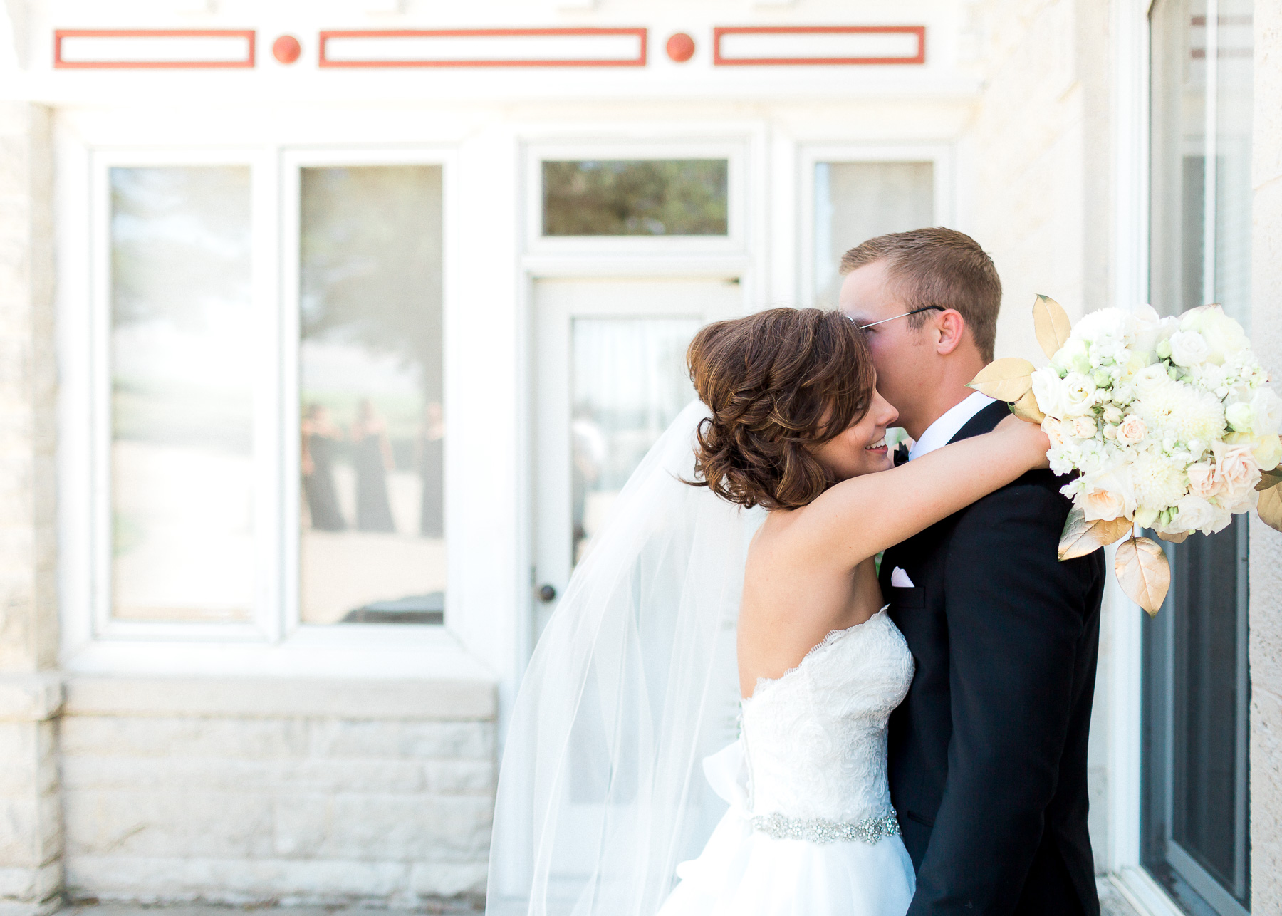 bride and groom hugging