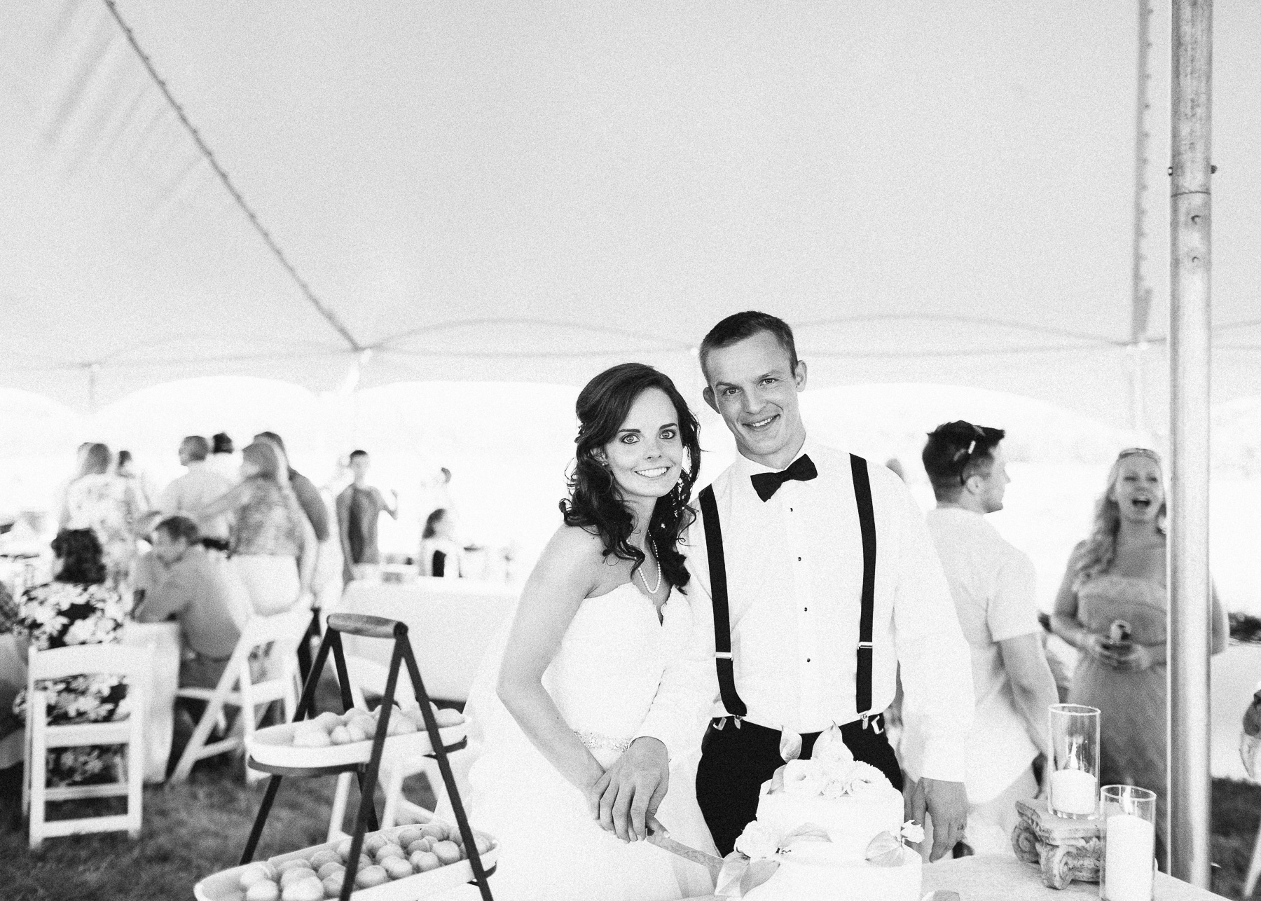 bride and groom cutting cake