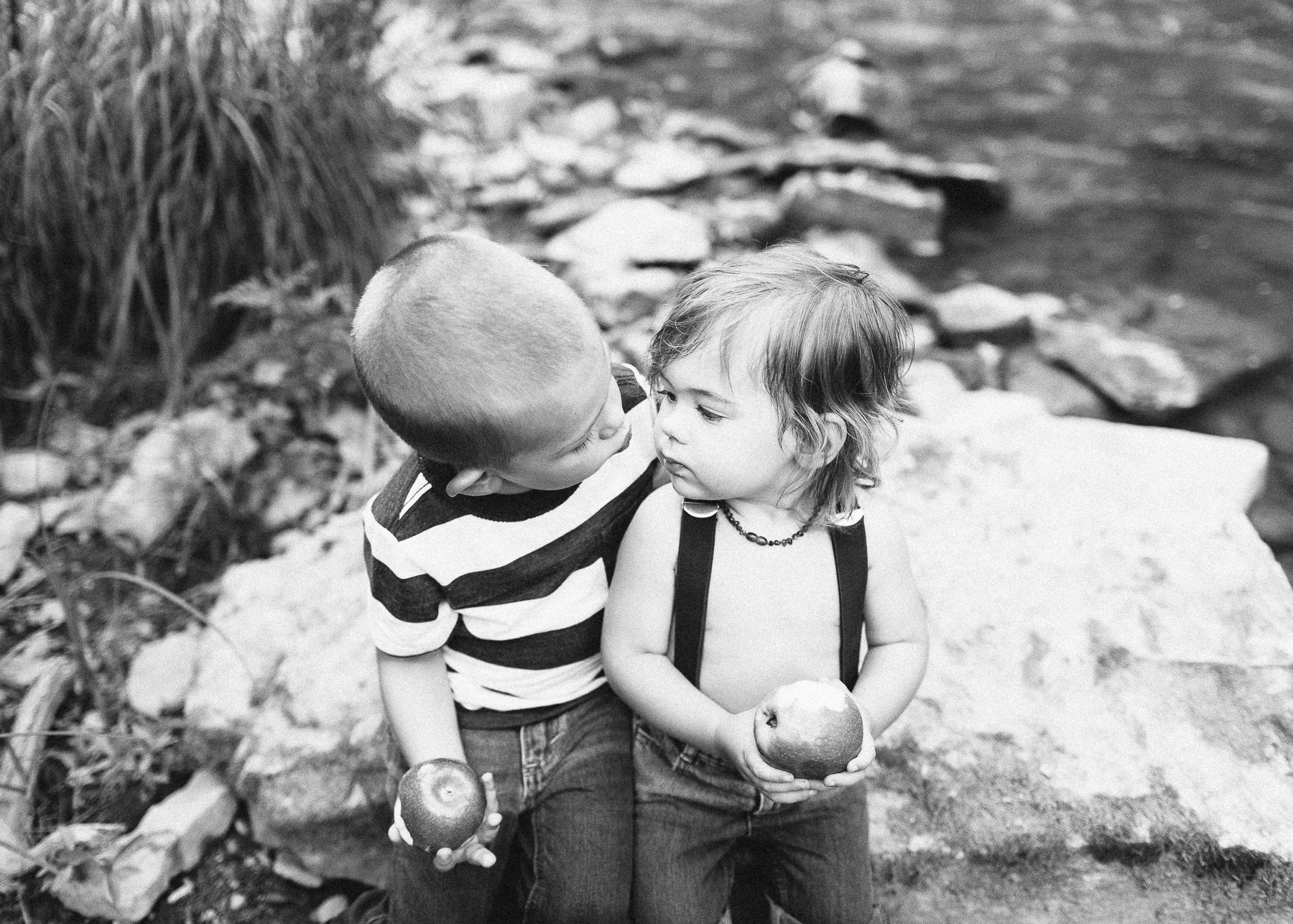 brothers eating apples together