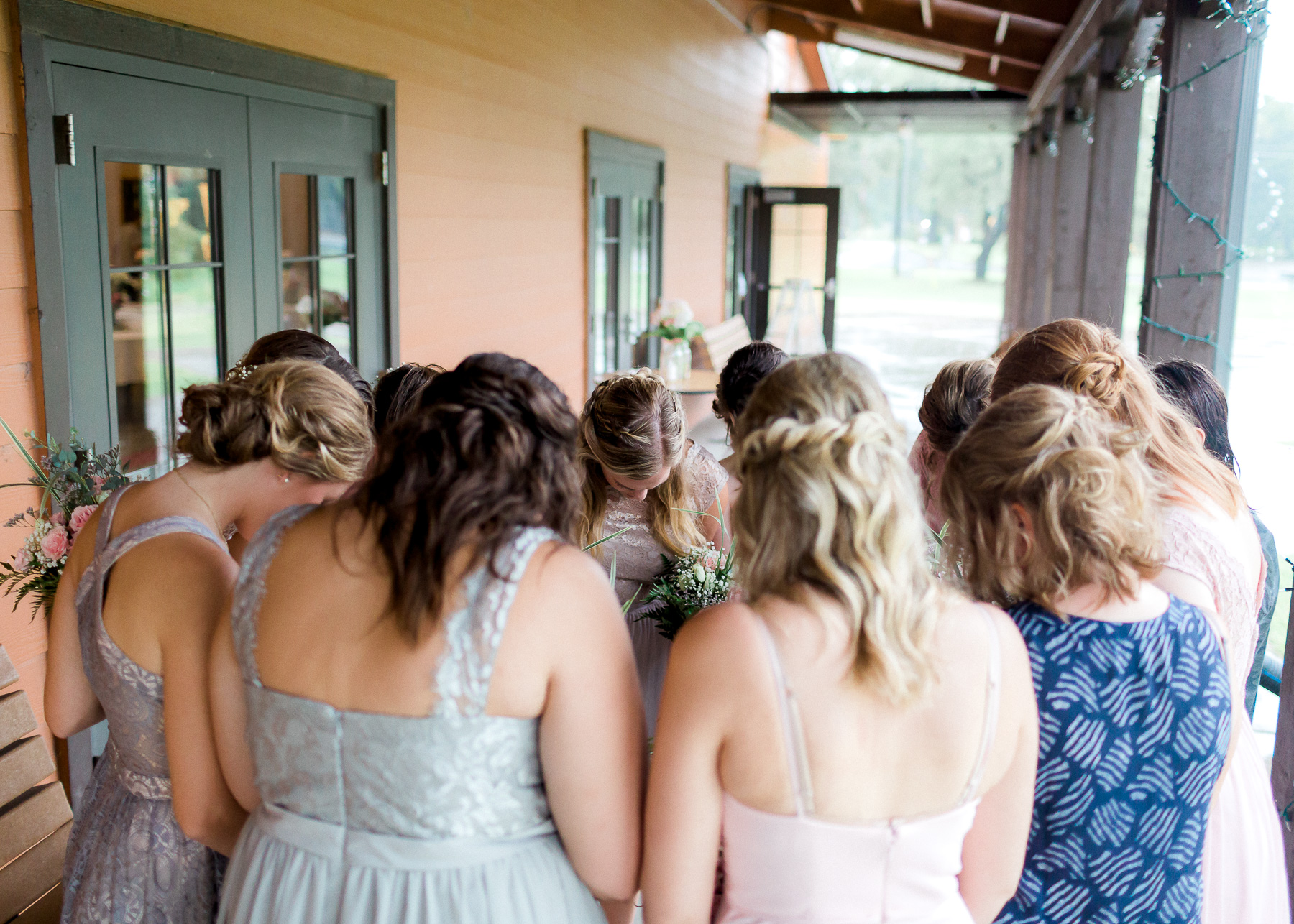 girl's gather to pray over her