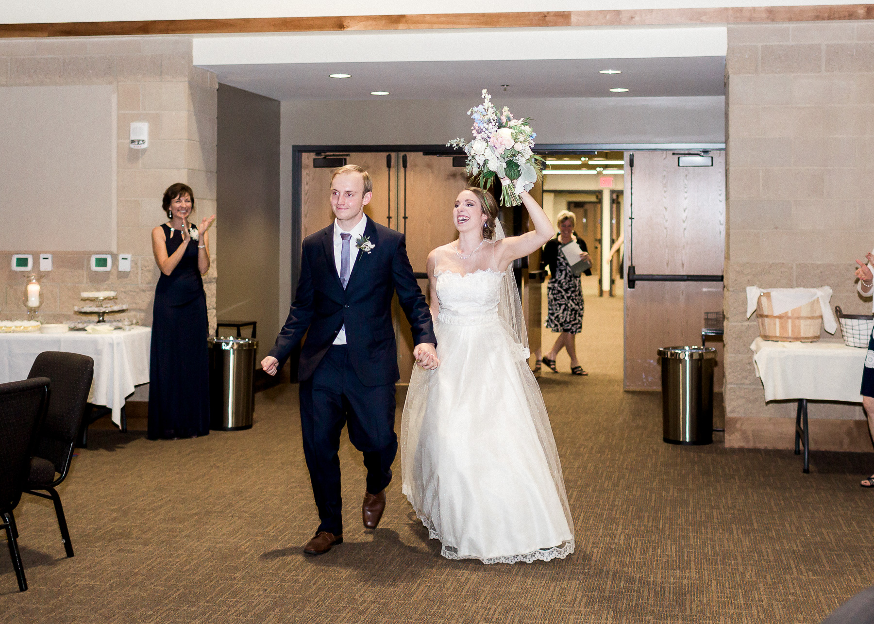 bride and groom enter reception