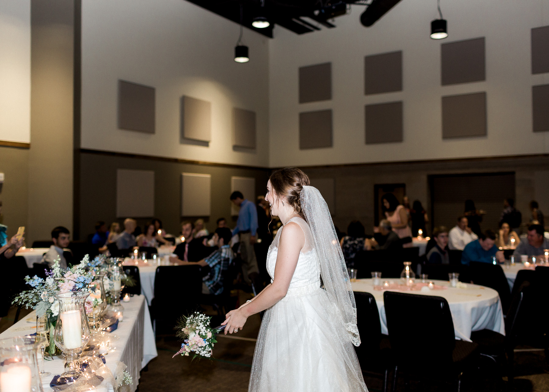 bride throwing her bouquet