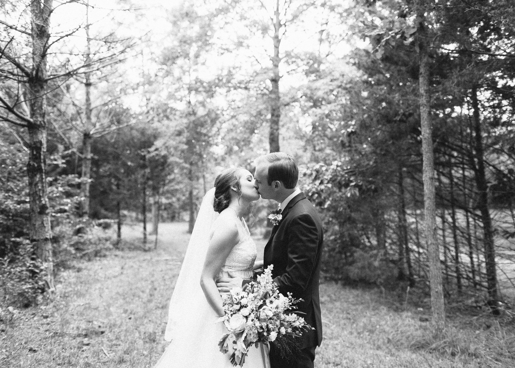 black and white bride and groom kissing