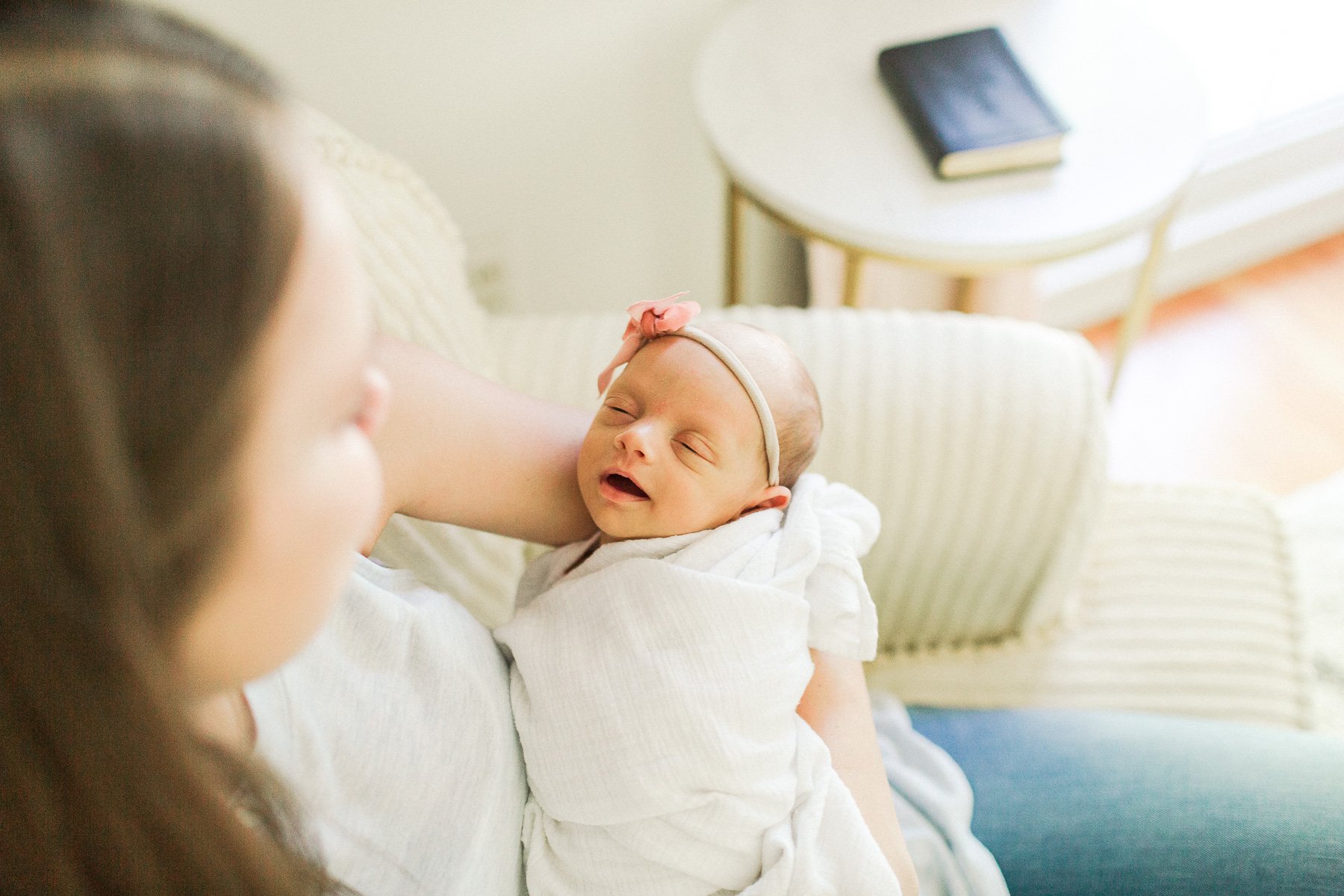 close up of baby smiling while sleeping