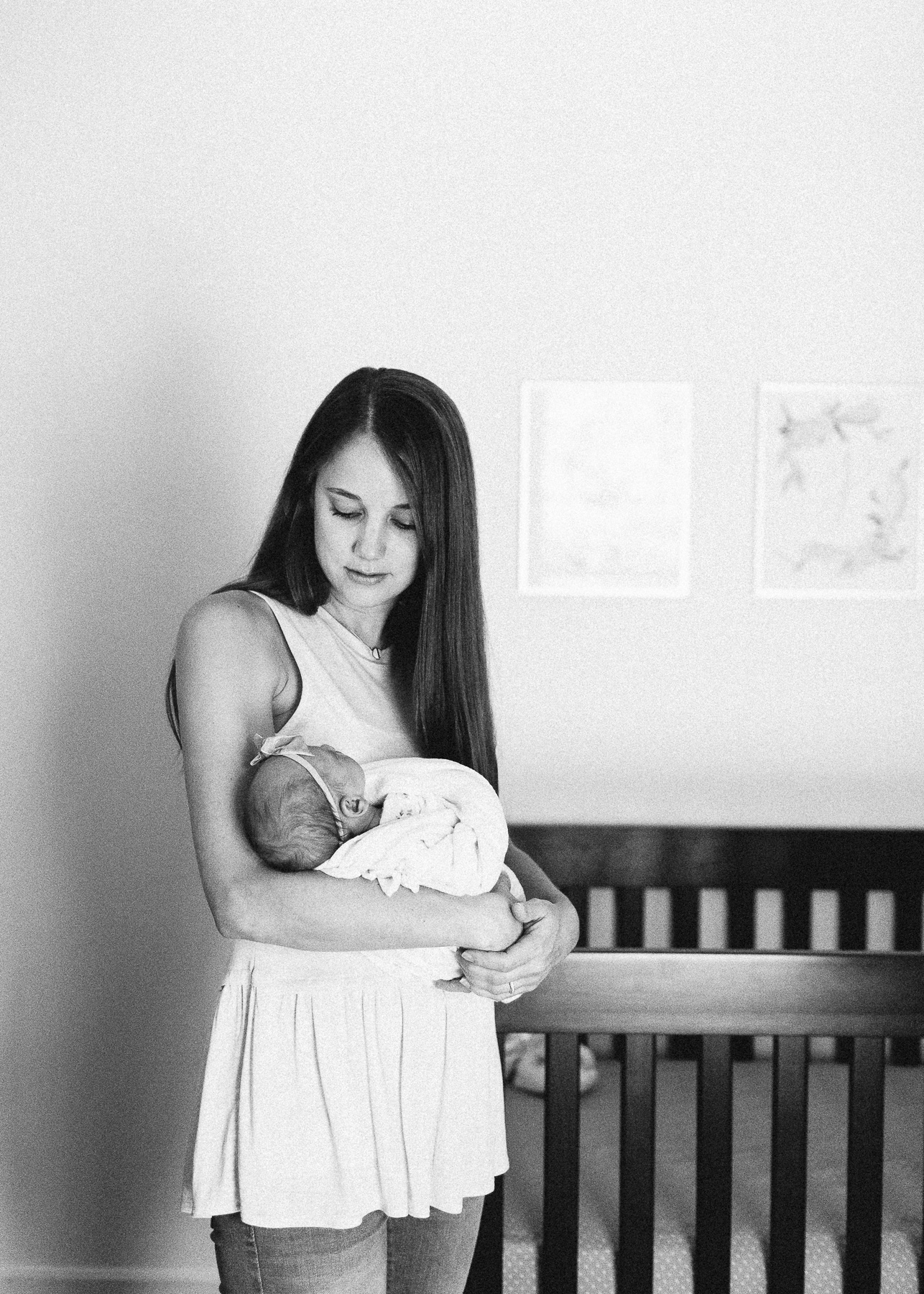 black and white of mama holding baby