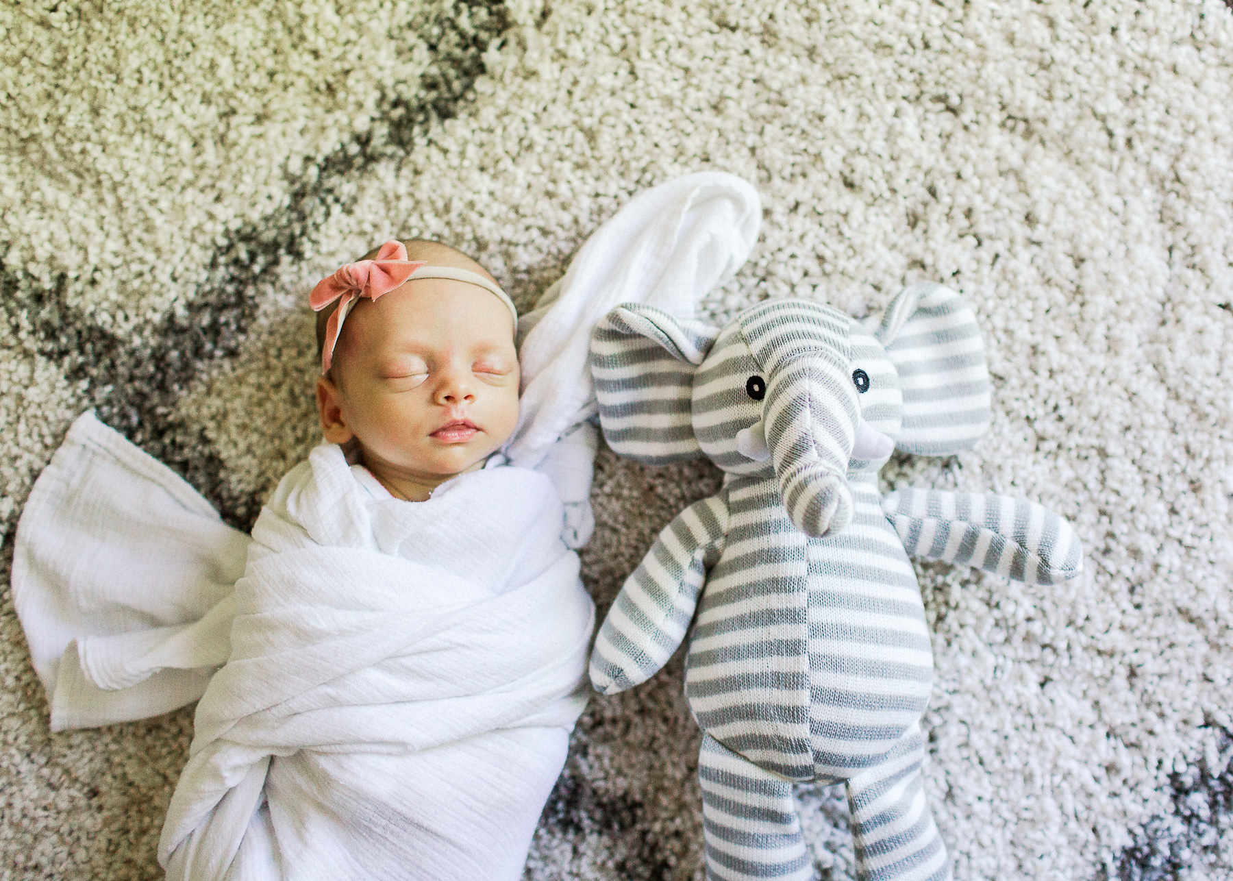 baby next to elephant stuffy